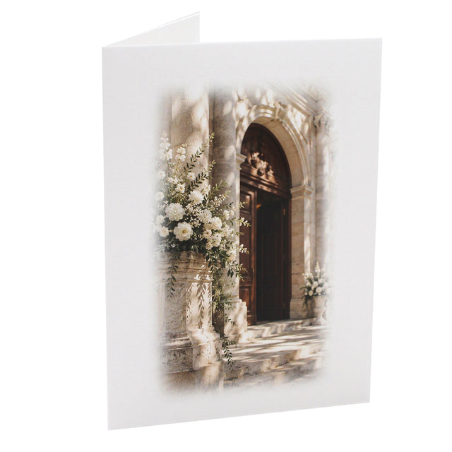 Cartonnage photo mariage vertical avec église fleurie et fleurs blanches